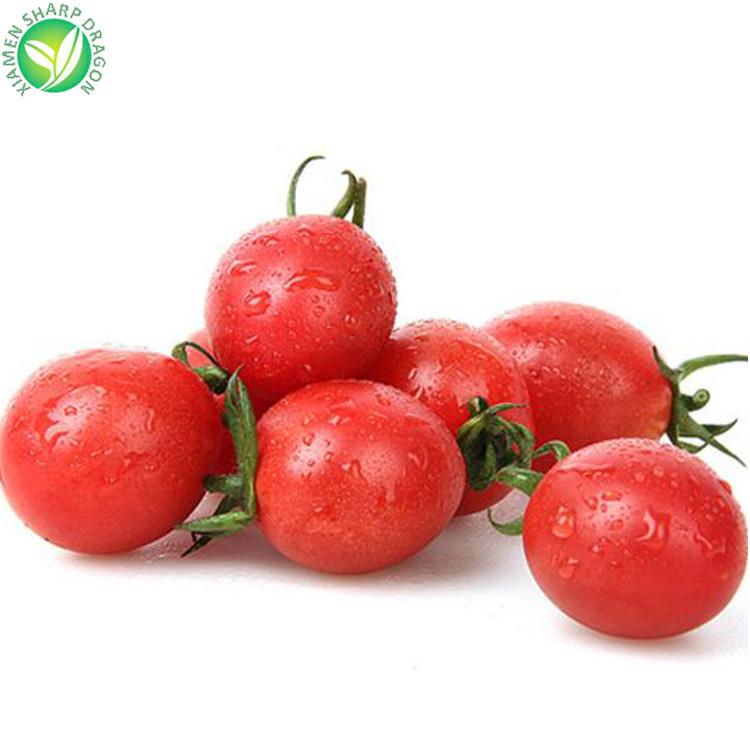 Red cherry tomatoes shown whole with green stems